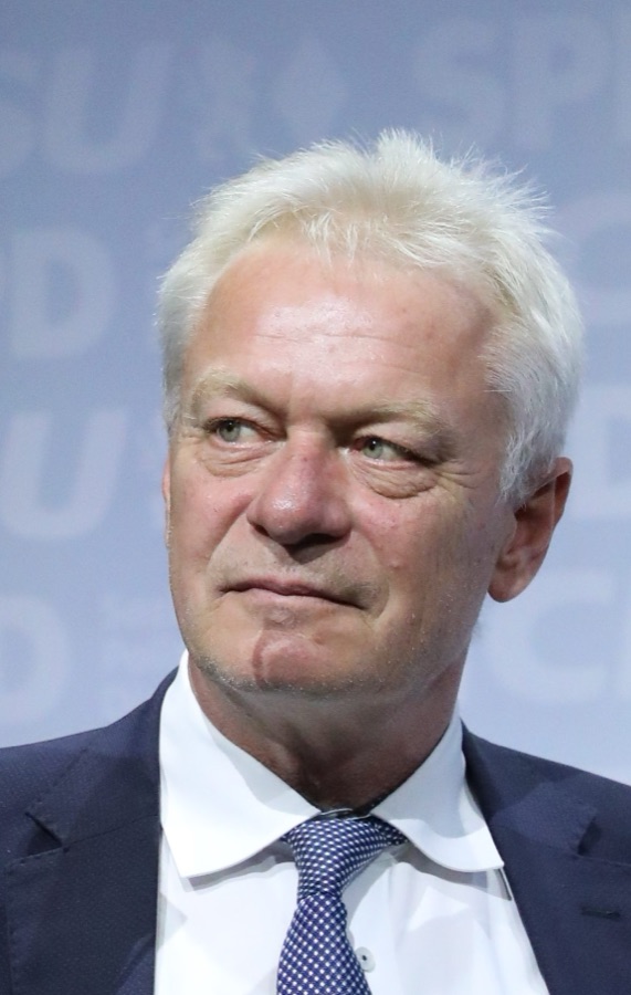 Alois Rainer in a dark suit at the coalition agreement signing, looking to the side